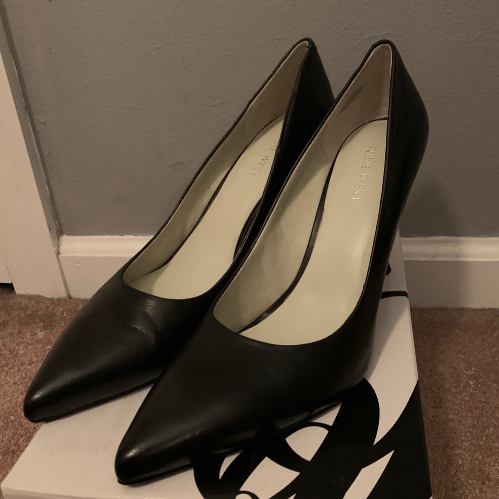 Black pointed toe heels. Size 9.